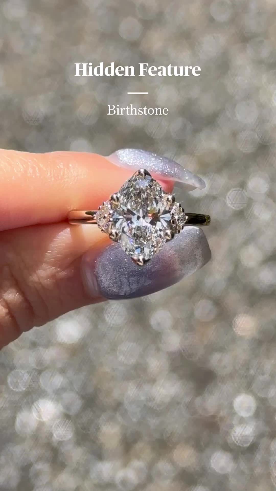 This may contain: someone is holding their engagement ring with the words hidden feature in front of her face