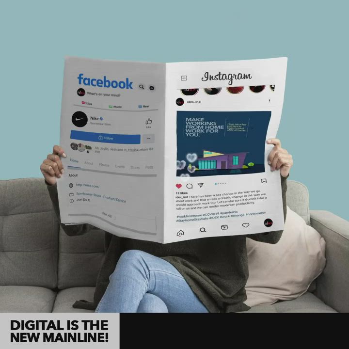 This may contain: a person sitting on a couch holding up a book to their face with the caption facebook digital is the new mainline