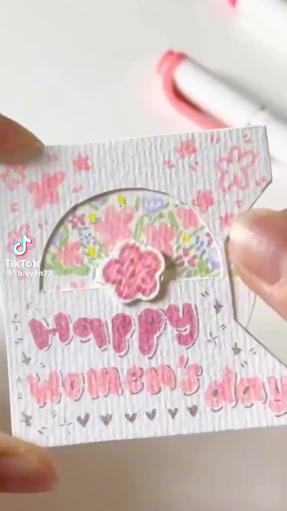 This may contain: someone is holding up a card with the words happy mother's day on it