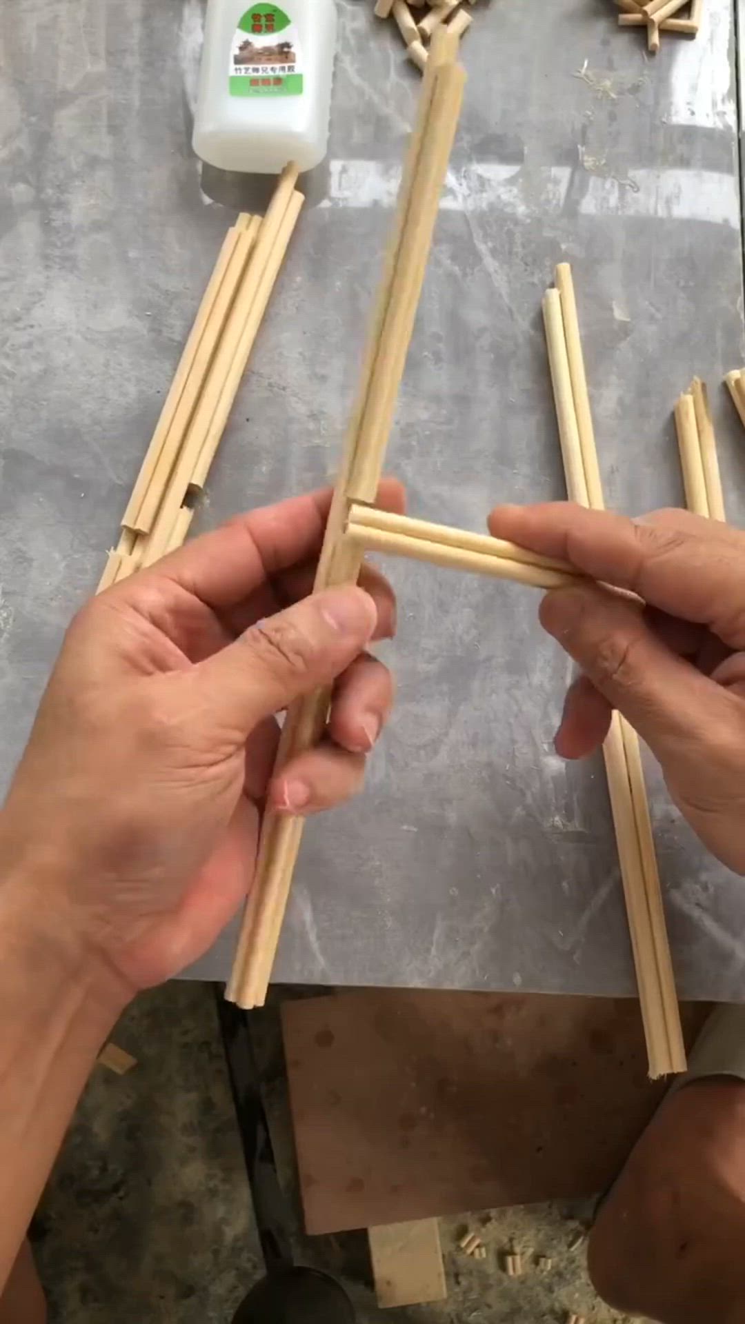 This contains an image of: Pavilion built with bamboo chopsticks