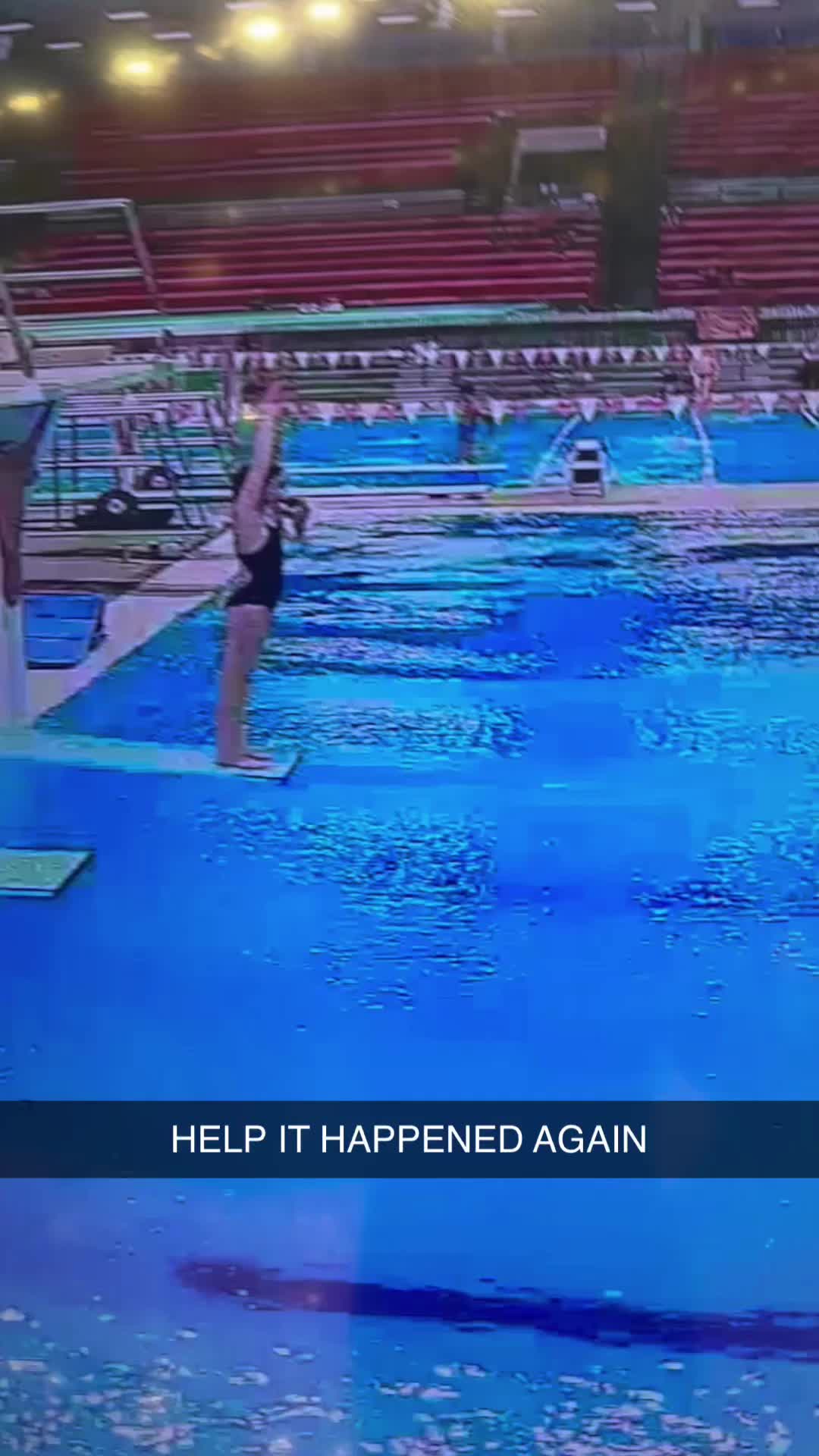 This may contain: two swimmers are in the middle of an indoor swimming pool