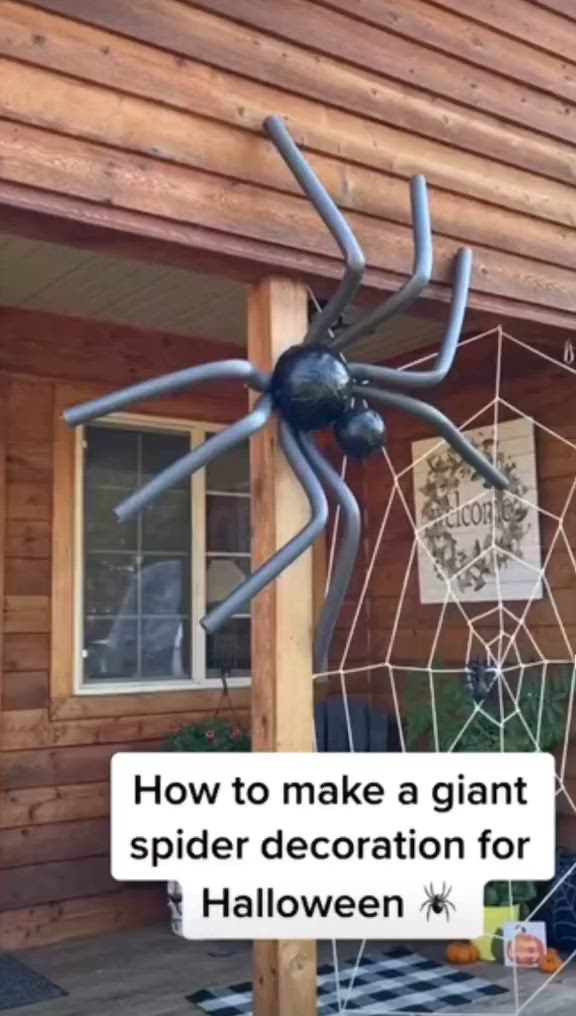 This may contain: a giant spider decoration for halloween is on display in front of a wooden house with the words how to make a giant spider decoration for halloween