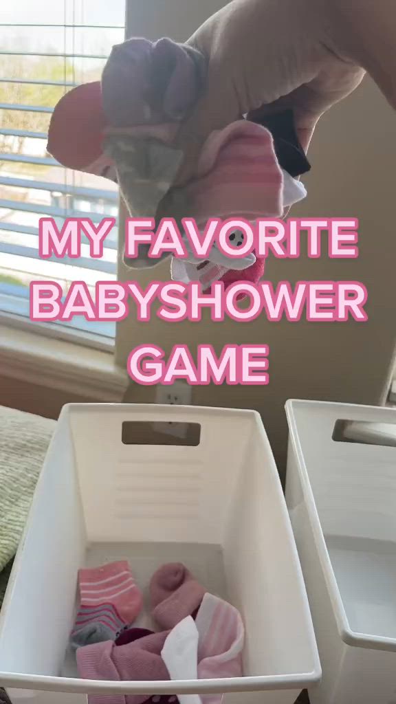 This may contain: two white boxes with clothes in them and the words, my favorite baby shower game