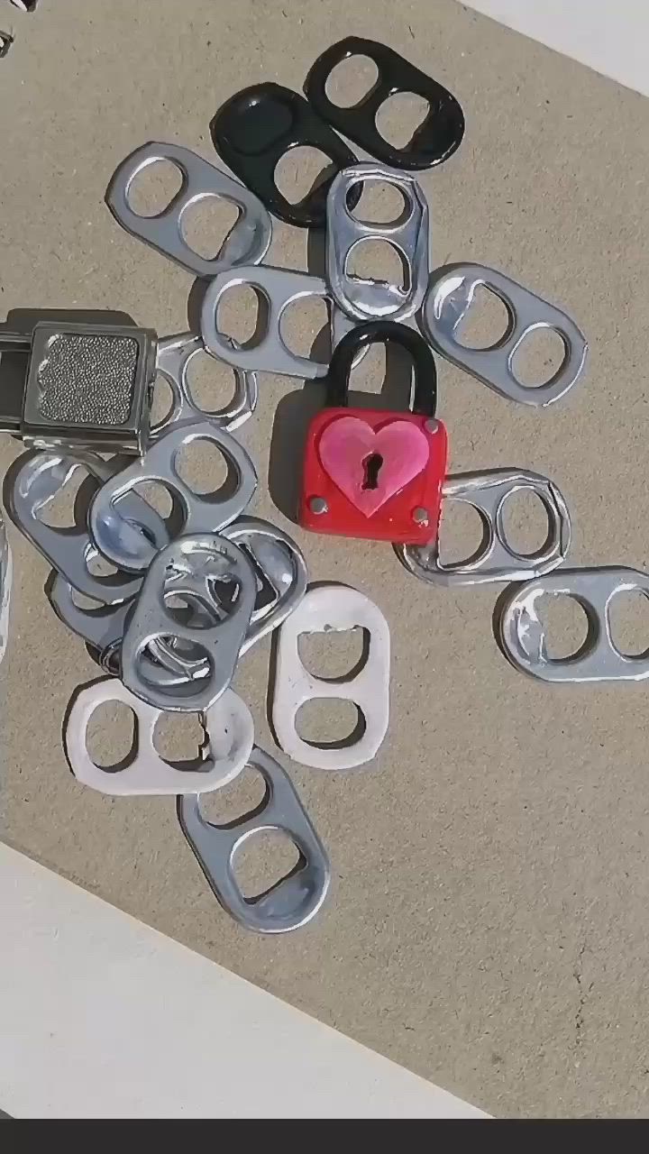 This may contain: several pairs of handcuffs with a heart shaped padlock on the ground next to them