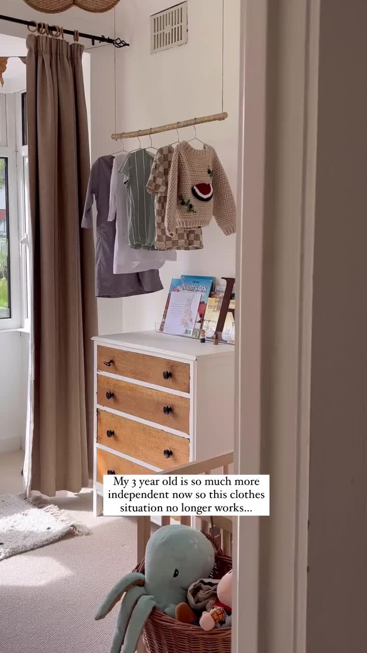 This may contain: an old wooden cabinet with clothes hanging from it's doors and the words, this is the final look if loves it but what do you think?