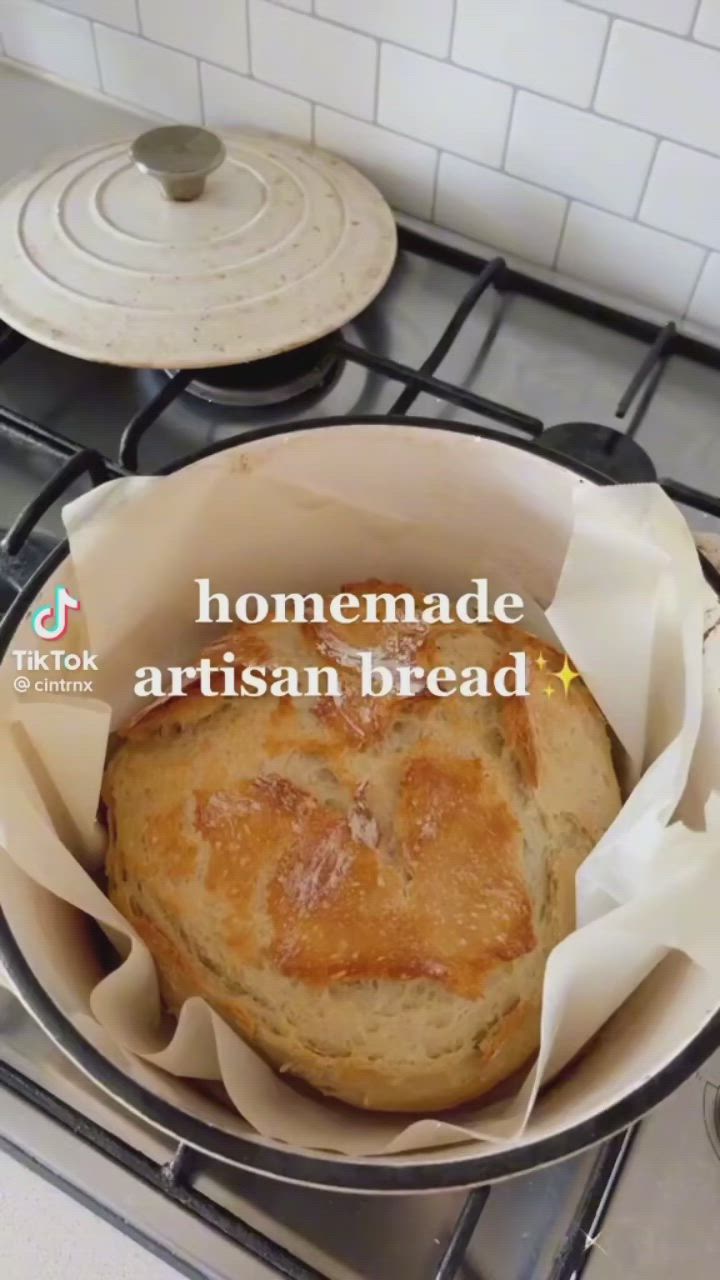 This may contain: a bread in a pan sitting on top of a stove