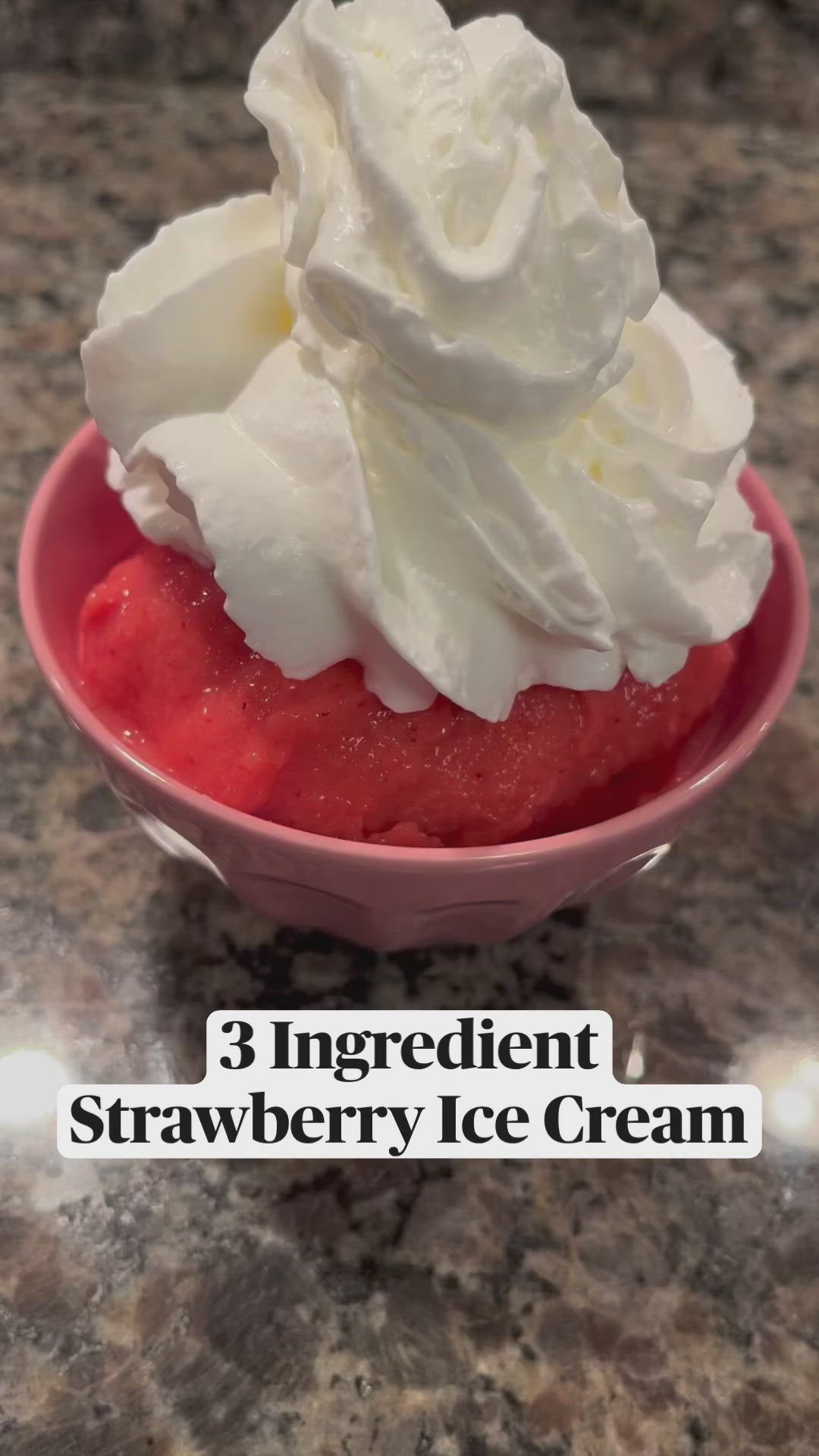 This may contain: a red blender filled with strawberries on top of a counter