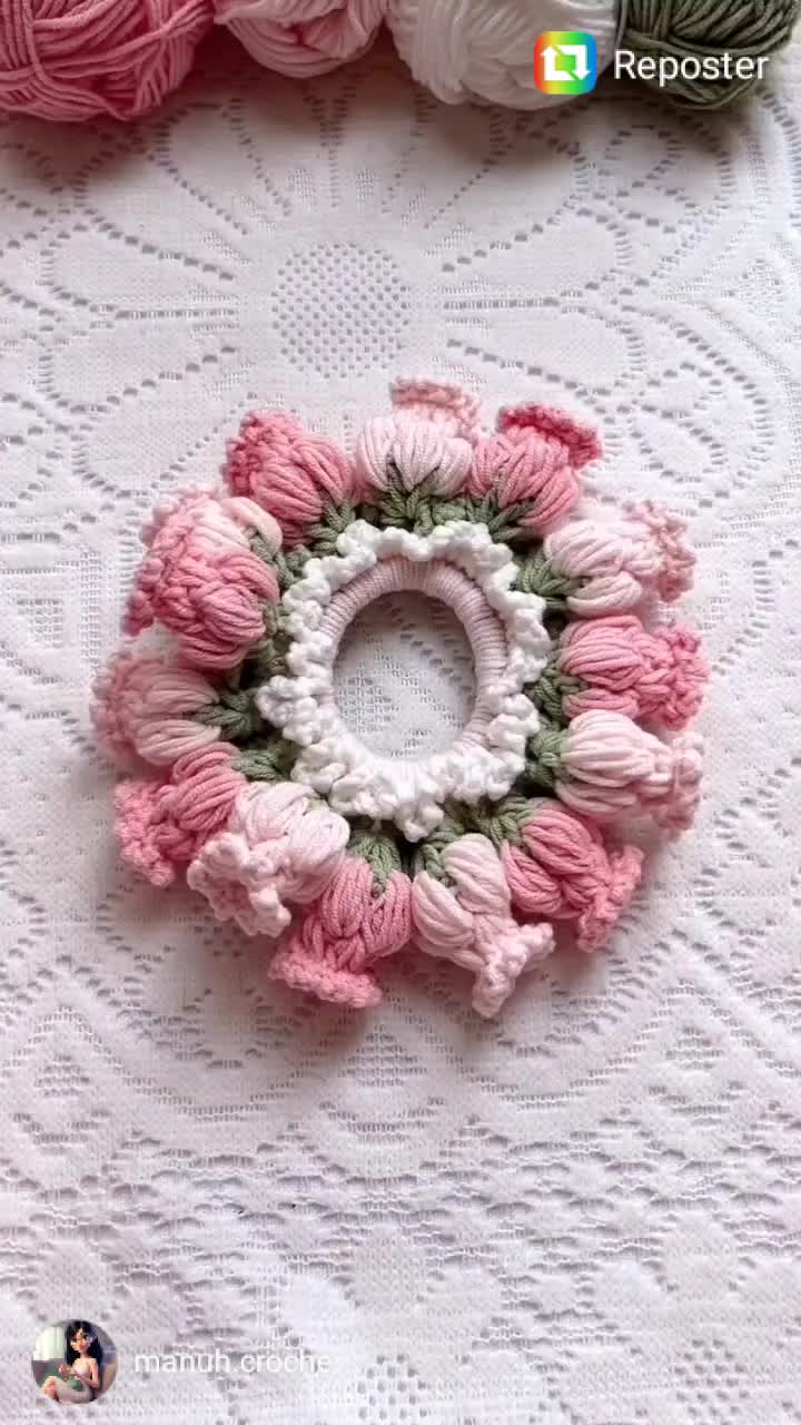 This may contain: two crocheted hair clips on top of a white doily next to each other