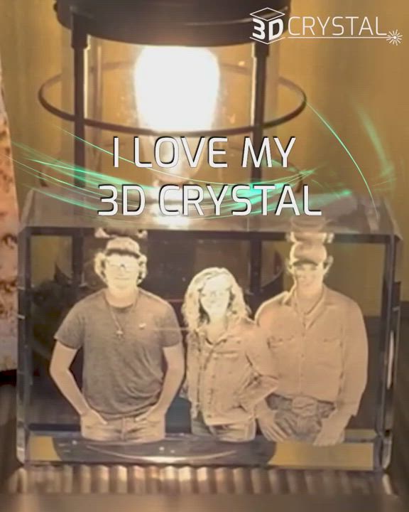 This may contain: two men and a woman standing in front of a table with the words i love my 3dcrystal on it