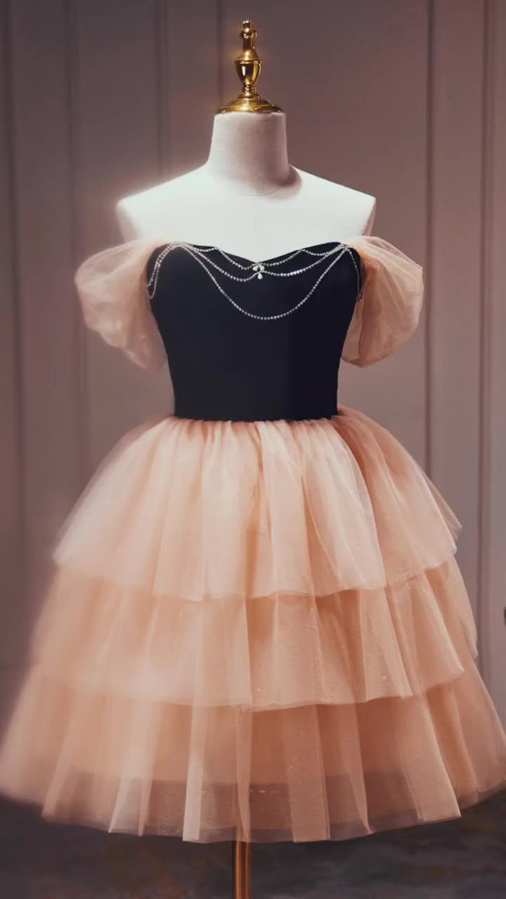 This contains: Short Layered Tulle Homecoming Party Dress with Off Shoulder