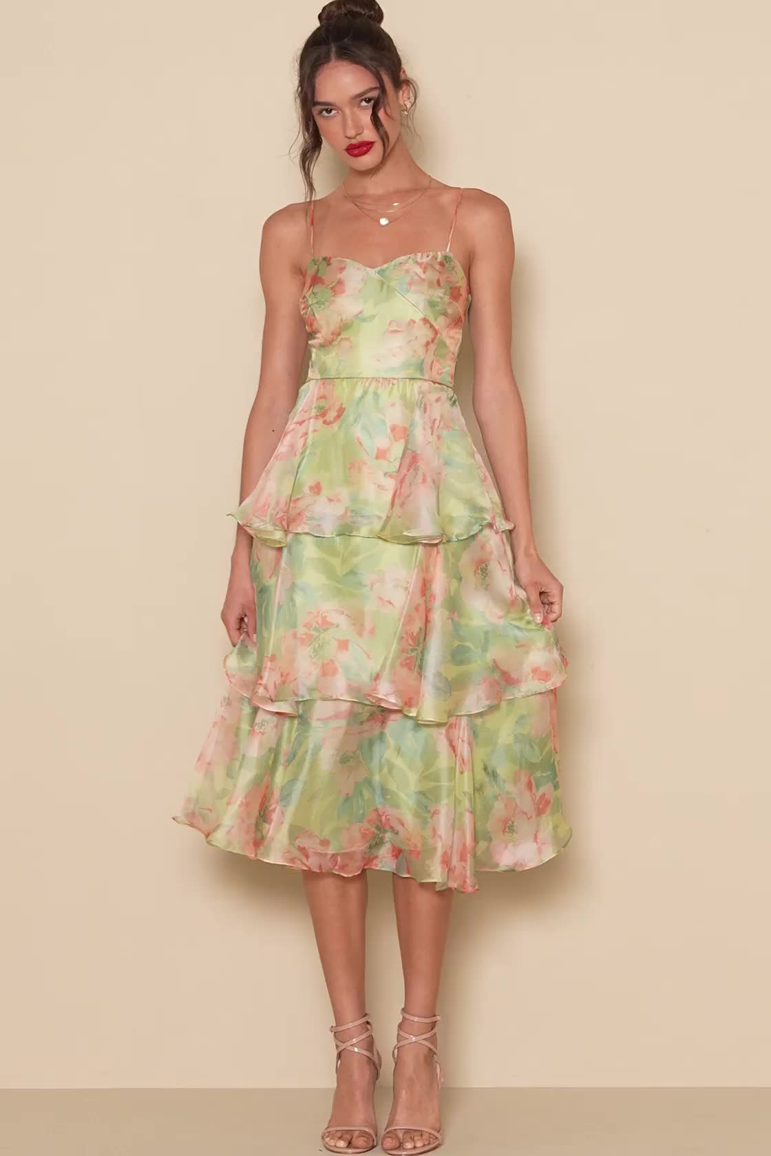 Springtime soirees just got a little sweeter now that the Lulus Darling Aesthetic Green Floral Print Tiered Midi Dress is on the scene! Airy woven organza boasts a lush floral print as it shapes adjustable spaghetti straps and a bodice with surplice-inspired seaming that gives an overlapping effect. Fitted waist sits above a skirt that falls in floaty tiers to a midi hem. Hidden zipper/clasp at back. Fit: This garment fits true to size. Length: Mid-calf length. Size medium measures 41" from adju