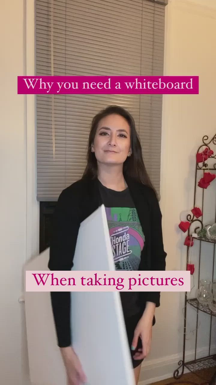 This may contain: a woman peeking out from behind a white board with the words, why you need a whiteboard when taking pictures