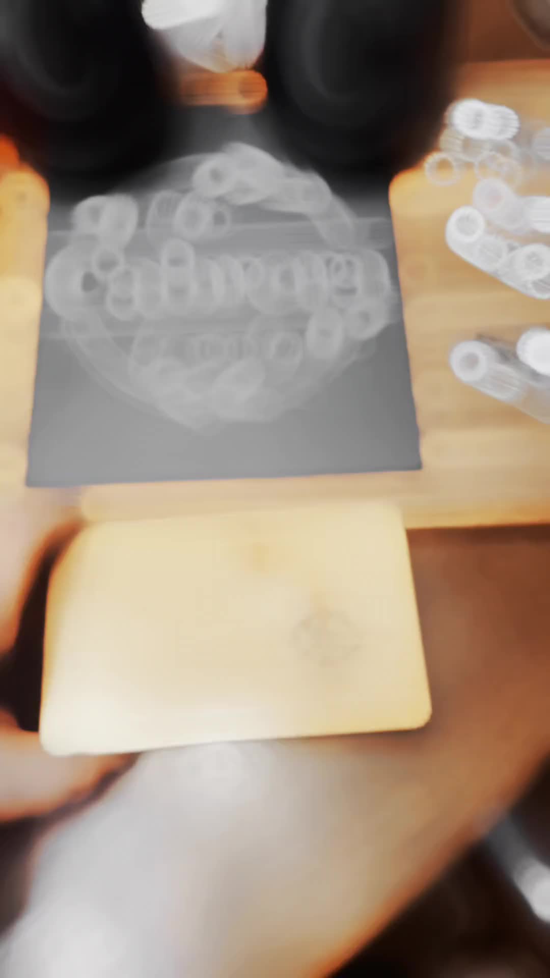 This may contain: a blurry photo of an object on a table with other objects in the background