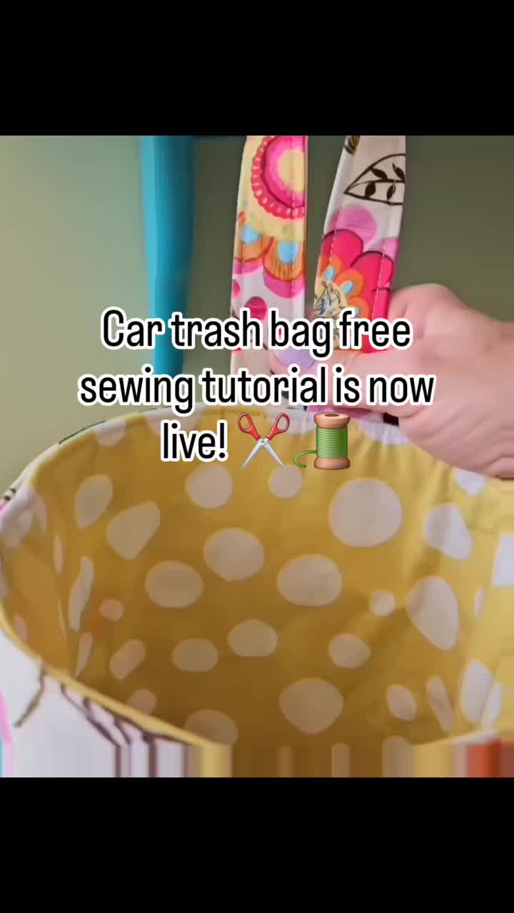 This may contain: someone is holding scissors in their hand and the words car trash bag free sewing tutorial is now live