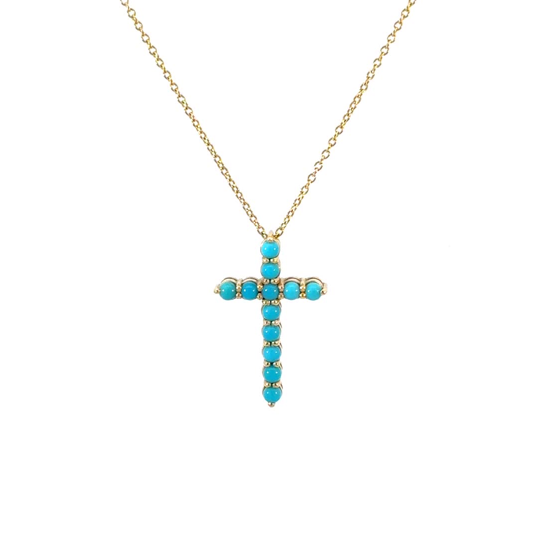 This modern Turquoise Cross necklace is handset in 14K Solid Gold with vibrant mm natural Turquoise. The Cross brings hope and faith to many and turquoise is a stone know to bring luck, peace and protection. Wear it as a reminder of strength and love. Pairs beautifully with our Turquoise Bead Bar Necklace.

Size: 25mm(H) x 15mm(W)
2.5mm Turquoise beads
Solid 14K Gold
Lifetime Guarantee
Made in Los Angeles
Due to the nature of Turquoise, color may vary