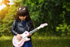 girl playing guitar