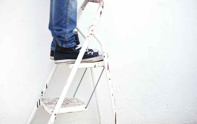 man painting the ceiling