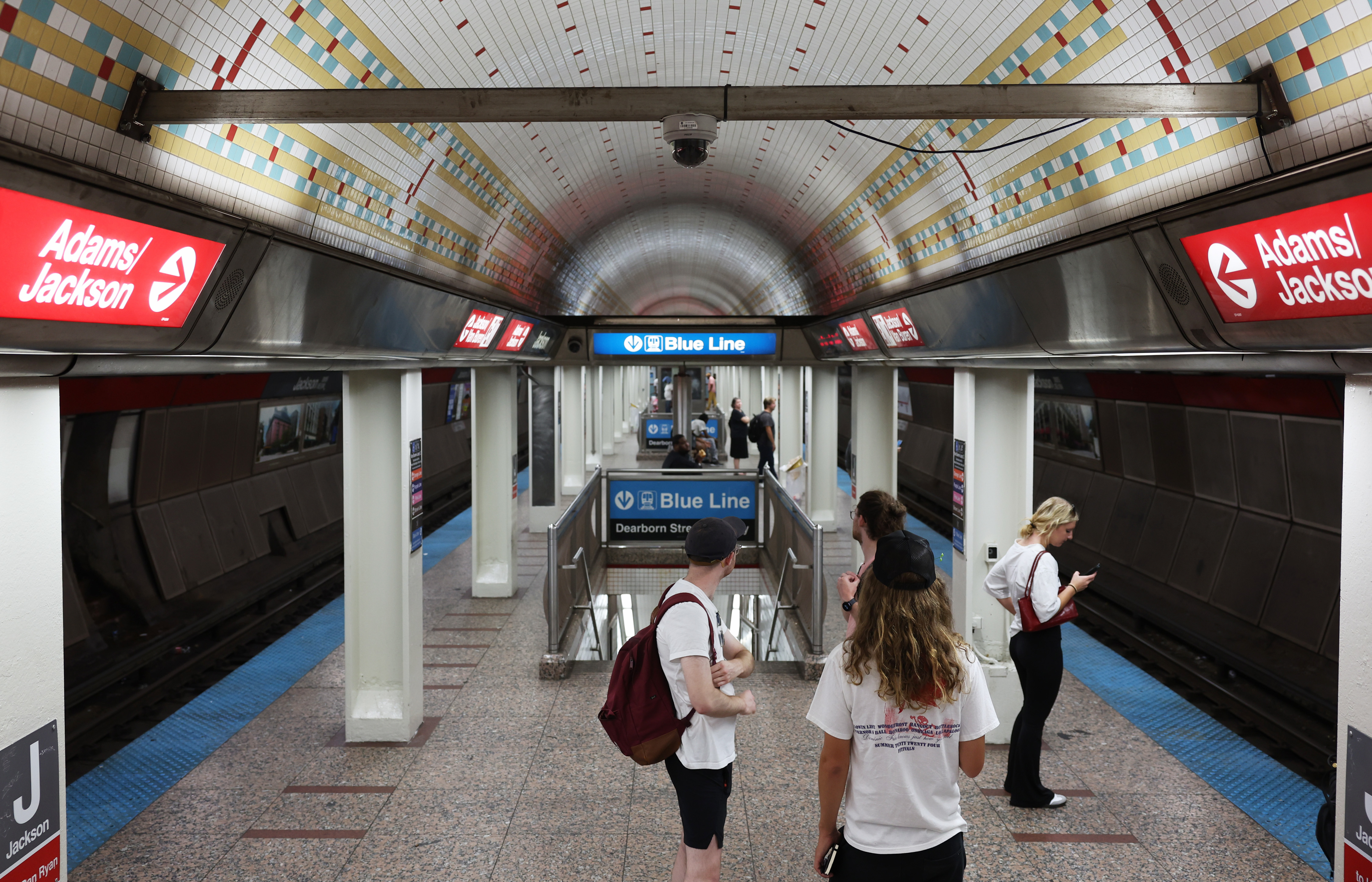 Passengers wait for a train on the platform at the CTA Jackson Red Line station on Aug. 28, 2024. (John J. Kim/Chicago Tribune)