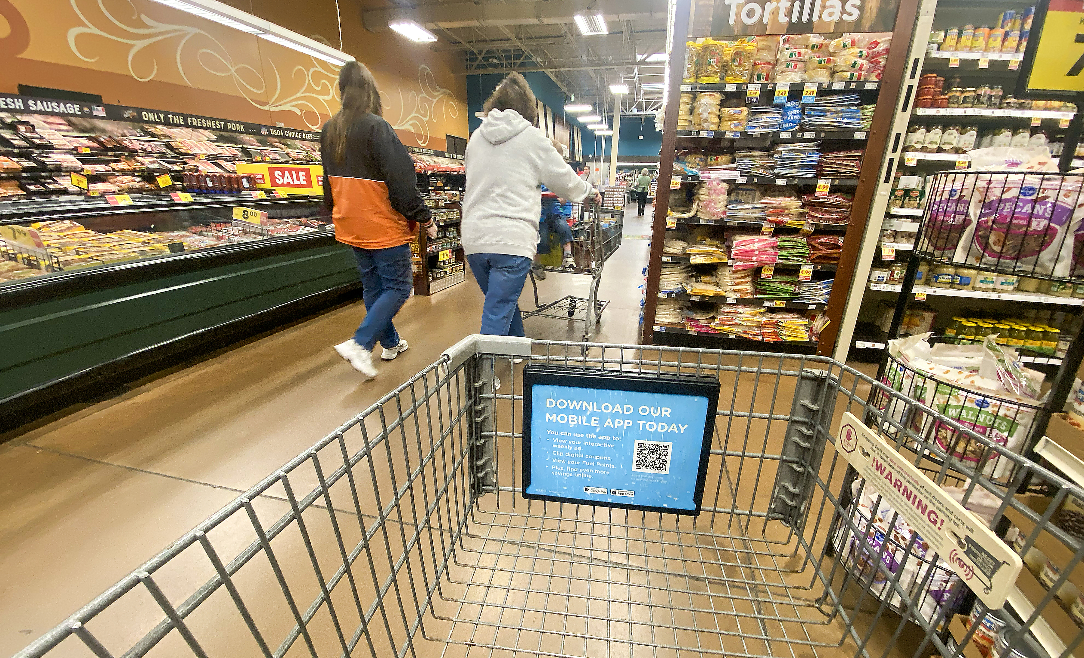 Customers shop inside a local supermarket on Friday Nov. 1, 2024. If 2L is passes it will provide necessary maintenance of parks, public spaces and recreation centers.(Jim Rydbom/Staff Photographer)