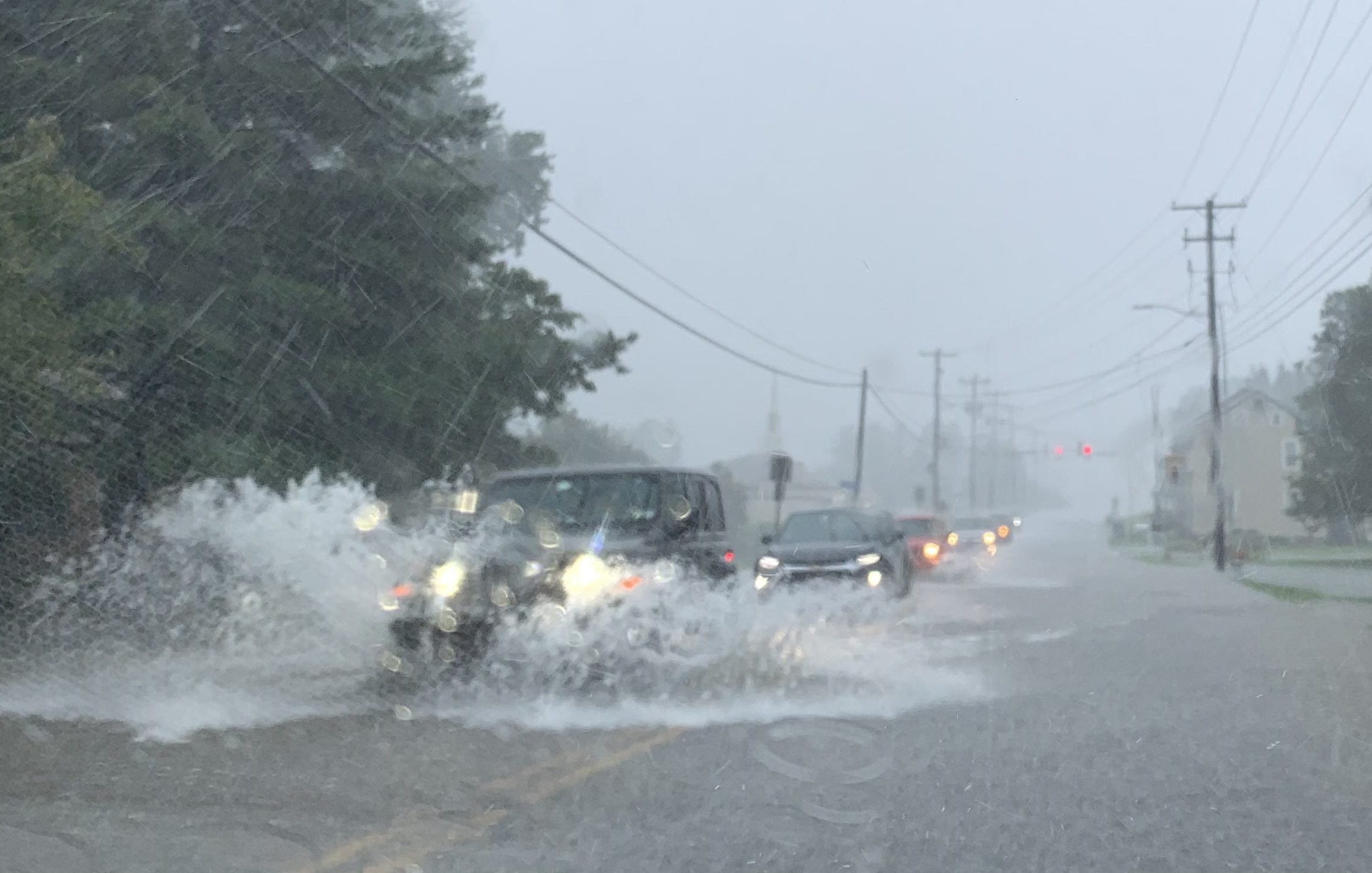 It was tough going Sunday on Van Reed Road in Spring Township during a downpour. (BILL UHRICH - READING EAGLE)