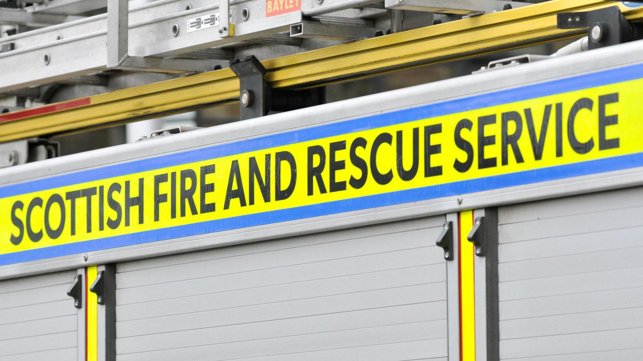 A close up of the side of a fire engine and the words: "Scottish Fire and Rescue Service".