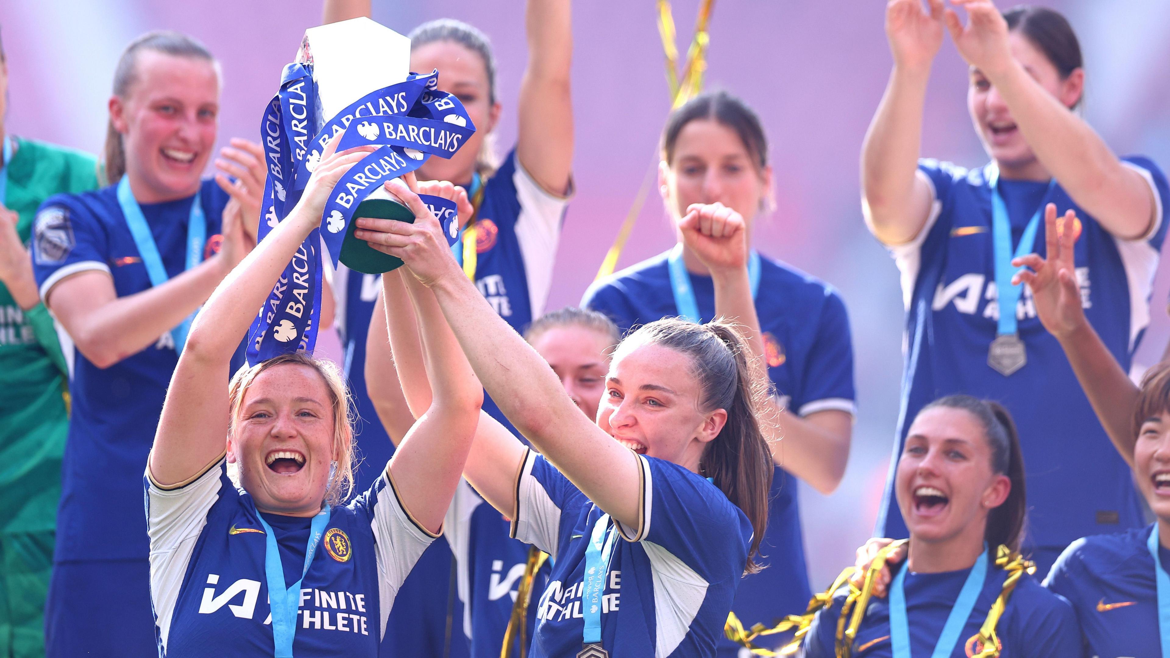 Chelsea's Erin Cuthbert and Niamh Charles lift the Women's Super League trophy