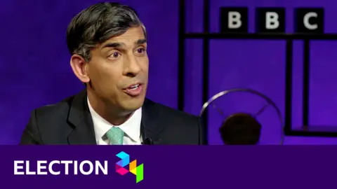 Rishi Sunak with the BBC's election banner underneath