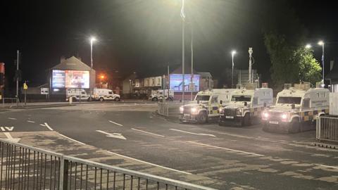 Police vehicles at Broadway roundabout in south Belfast on 15 July, 2024