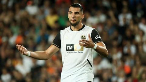 Valencia striker Rafa Mir gestures during a game