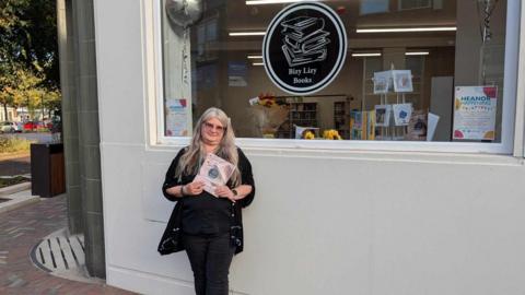 Elizabeth Barrow stood outside her shop Bizy Lizy books