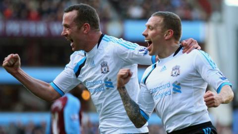 Charlie Adam and Craig Bellamy celebrate scoring for Liverpool