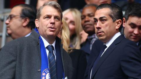 Todd Boehly and Behdad Eghbali standing and talking at the Carabao Cup Final in February 2024