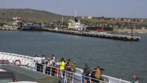 A ferry carrying vehicles travels on the shores of Port Kavkaz in Krasnodar in 2023