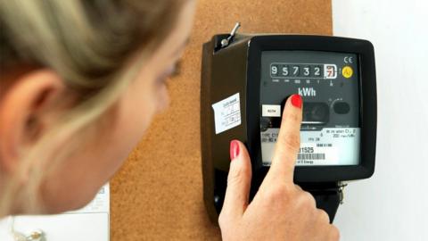 Woman looking at a payment meter