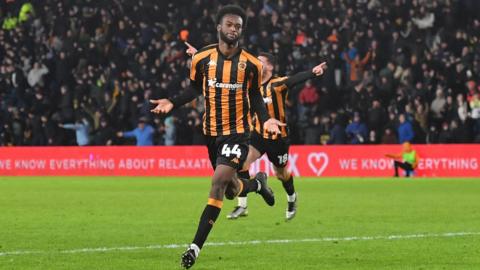 Abu Kamara celebrates scoring a goal against Leeds United