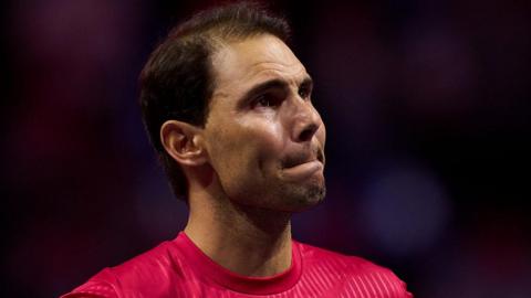 An emotional Rafael Nadal watches a tribute video after retiring from tennis