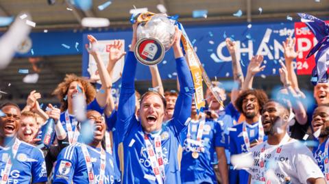 Marc Albrighton lifting the Championship trophy for Leicester