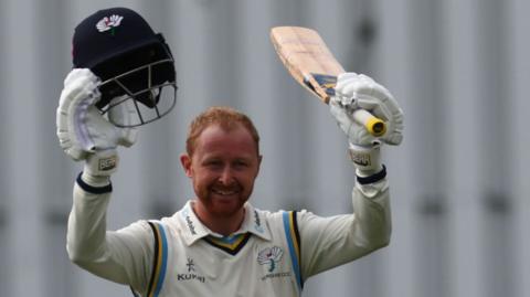 Yorkshire captain Jonny Tattersall raises his bat