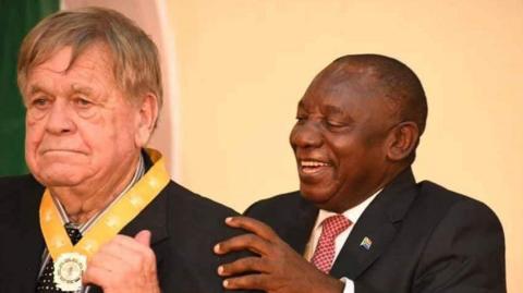 William Smith getting an award from President Cyril Ramaphosa in 2019 for teaching and demystification of mathematics and science