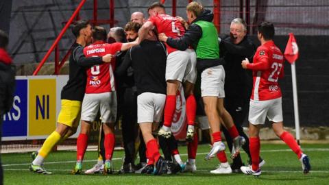 Larne celebrate shootout win