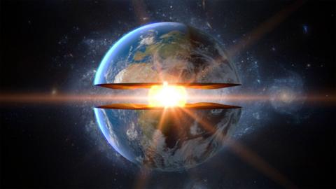 The Earth split in two across the equator with a bright orb at its centre