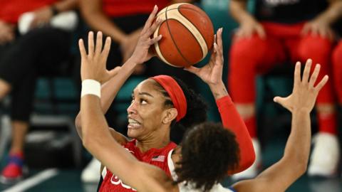 A'Ja Wilson of United States in action with Janelle Salaun of France