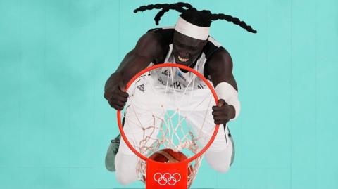 Wenyen Gabriel #9 of Team South Sudan dunks the ball during the match.