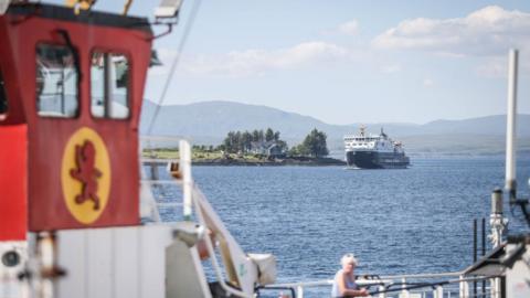 Ferries passing one another at sea