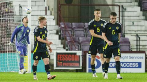 Scotland players look dejected after their loss to Spain at Tynecastle.