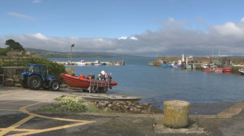 Boat with tractor at harbour near Helvick in County Waterford