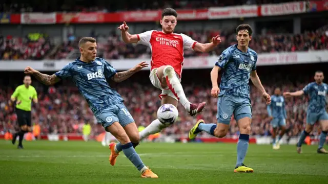  Declan Rice of Arsenal is challenged by Lucas Digne and Pau Torres