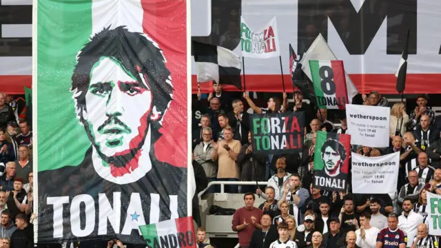 Flags in support of Sandro Tonali as he returned to Newcastle's team after his ban