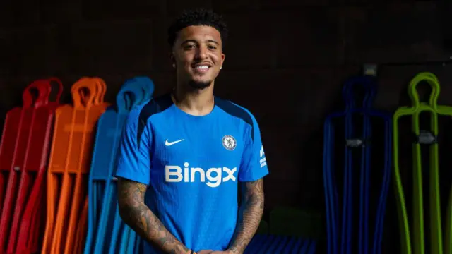 Jadon Sancho poses for pictures as he signs for Chelsea Football Club at Chelsea Training Ground on August 31, 2024