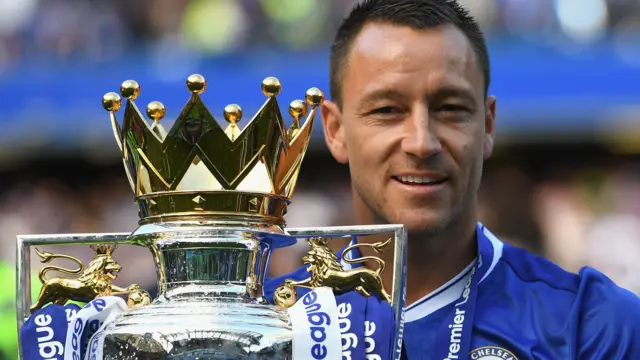 John Terry holds the Premier League trophy